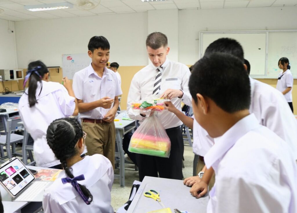 BFITS Thailand Teacher Chris Whearty making balloon-powered cars with his M1 students