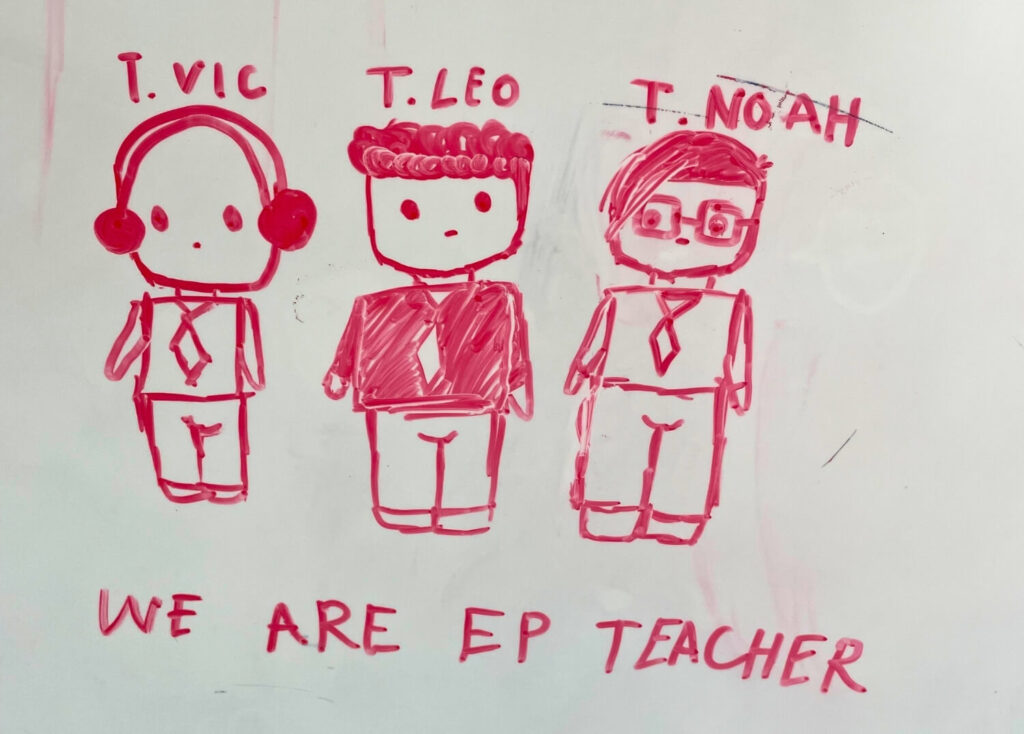 Cartoon-style whiteboard drawing of BFITS teachers T. Vic, T. Leo, and T. Noah with the phrase “We Are EP Teacher” written below
