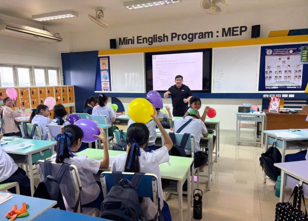 BFITS Teacher Anthony Ferrer leading a balloon experiment as students explore science concepts through hands-on learning